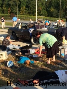 Victims after car crashes into yard sale.